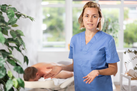 The skilled therapist presents massage proceduresの写真素材