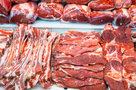 Fresh raw veal chops, tenderloin, short ribs and steaks in showcaseの写真素材