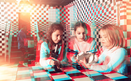 Attentive children solve puzzles in quest roomの写真素材