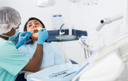 Female patient during dental checkup in dentist officeの写真素材