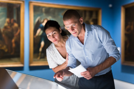 Man and woman in galleryの写真素材