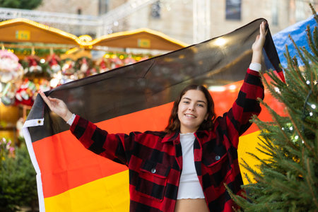 Girl with Germany flag at new year street fairの写真素材