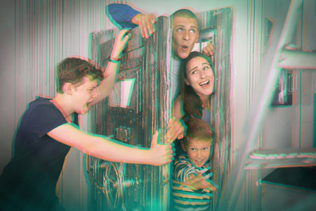 Close-knit family in solving puzzles to get out of the escape roomの写真素材