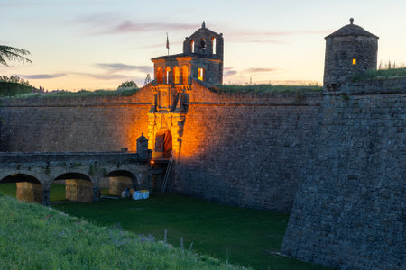 Shot of nighttime evening bastion of Jaca and its surroundings, medieval city fortificationsの写真素材