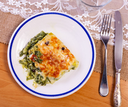 Lasagne with spinach served on platterの写真素材