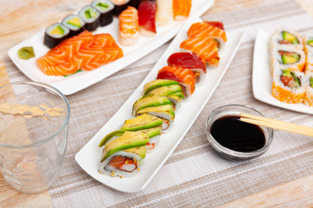 For several guests, Japanese lunch is served - set of uramaki rolls, soy sauce,の写真素材