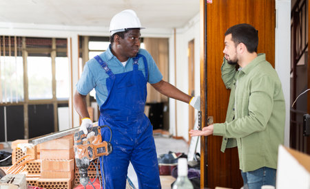 Owner came to the apartment to check the progress of the repair workの写真素材