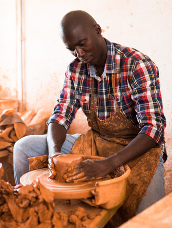 Potter working at pottery studio