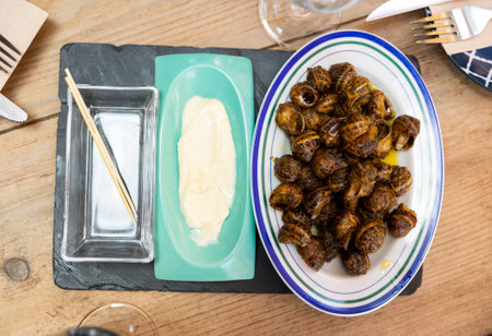 Snails tapa - Andalusia traditional food on tableの写真素材