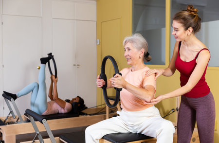 Mature European woman performing an exercise with a special ring