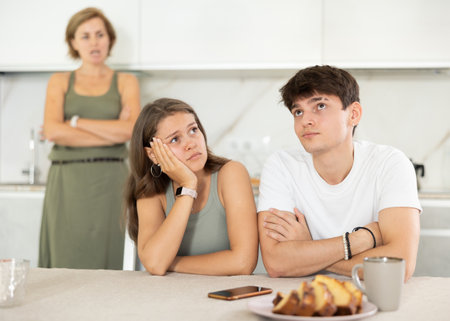 Woman swears at young married coupleの写真素材