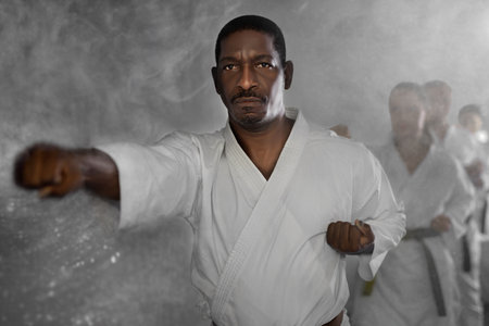 Group of multiethnic people training karate techniquesの写真素材