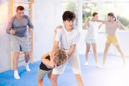 Two boys practicing self-defense techniquesの写真素材