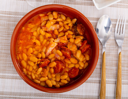Stewed beans served with chorizo piecesの写真素材