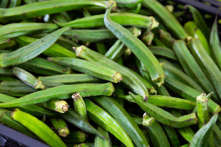Fresh green okra on counter market. Organic vegetable, Asian food ingredientsの写真素材