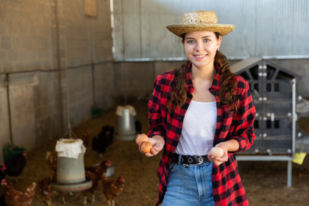 Portrait of a young girl, holding hens eggs in her handの写真素材