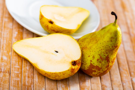 Juicy pear fruits served to tableの写真素材
