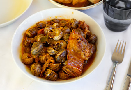 Stewed snails with rabbit meat and sausagesの写真素材