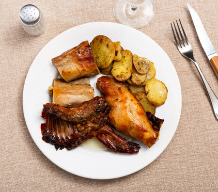 Baked rabbit with potatoesの写真素材