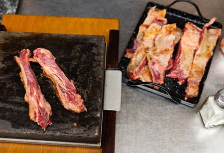 Hot stone cooking of beef meatの写真素材