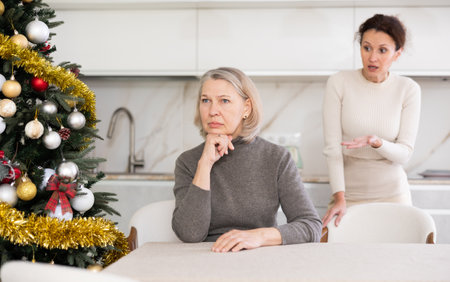 Adult woman quarreling with elderly womanの写真素材