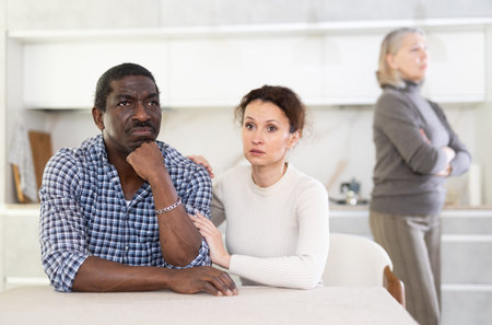 Wife calms husband down during quarrel with mother-in-law