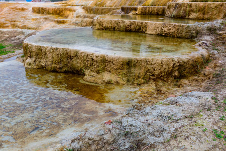 Travertine terraces with hot water of Karahyit Red Springs, Turkeyの写真素材