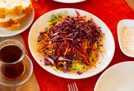 Turkish salad from chopped cabbages and grated carrots with olive oil and spicesの写真素材