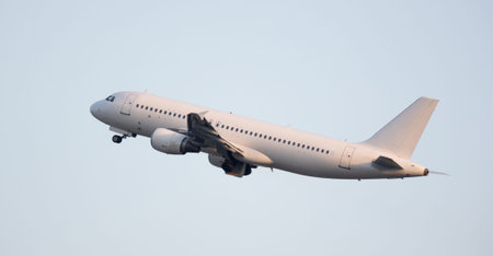 Modern passenger airliner on takeoff in sky