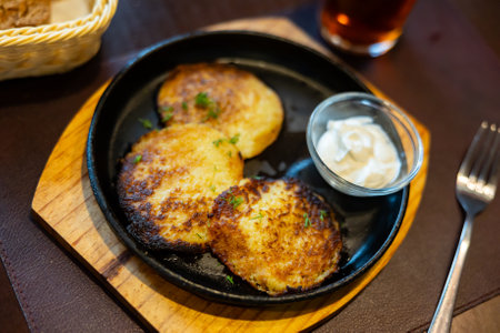 Potato pancakes served with sour creamの写真素材