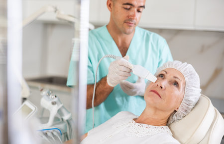 doctor uses skin scrubberの写真素材