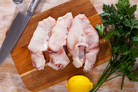 Raw seafood, fresh tiger shark fillet on boardの写真素材