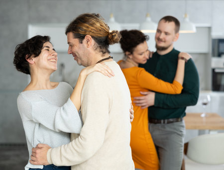 Men and women dancing during house party.の写真素材