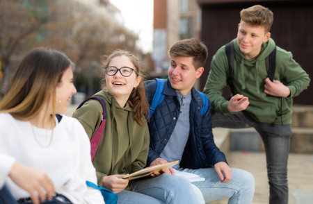 Group of positive teenagers having fun togetherの写真素材
