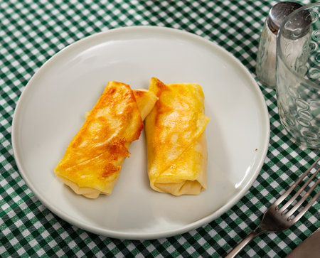 Polish savory crepes nalesniki with cream cheese, garlic and herbsの写真素材