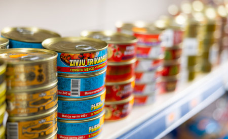 Russian goods store shelves have wide range of canned sprats in oil and tomato sauceのeditorial素材