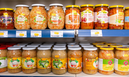 BADALONA, SPAIN - February 12, 2024: Jars of sauerkraut on shelves of a Russian grocery store in Spain. Traditional Russian appetizerのeditorial素材