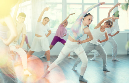 Group of children warming up before dance class