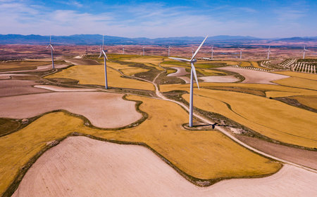 Wind Turbines at farmland in summer near the town of La Muela