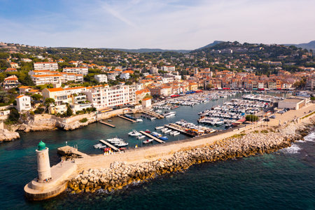 Aerial view of Cassis cityscape on Mediterranean coast with marina and lighthouseの写真素材