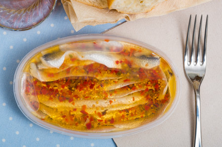 Marinated herring fillet in a plastic jarの写真素材
