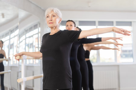 Group of women practicing at ballet barreの写真素材