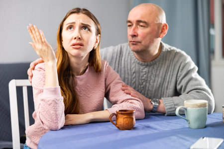 Man tries to comfort his upset wifeの写真素材