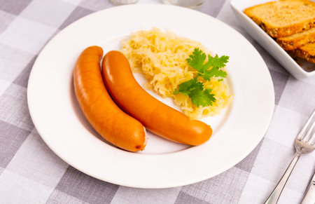 Tasty sausages with side dish of sauerkrautの写真素材