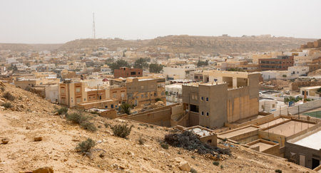 Sun-drenched Ghomrassen cityscape with modern and ancient buildingsの写真素材