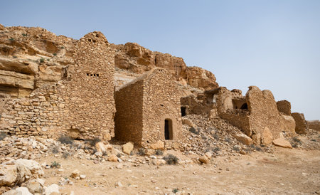 View of ancient abandoned town of Ghomrassen, Berber houses and granaries, Tataouine region of Tunisiaの写真素材