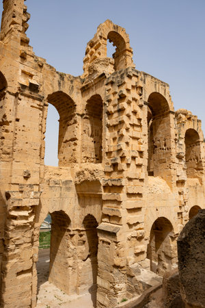 Arches in the exterior walls of the Roman amphitheatre in El Jem, Tunisiaの写真素材