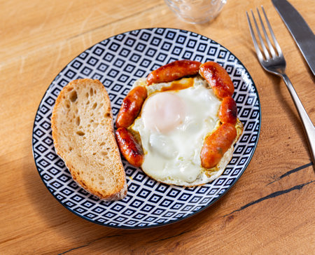 Homemade hearty breakfast - fried eggs with chorizo sausage.の写真素材