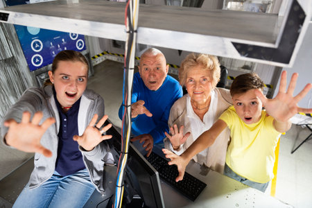 Group photo of grandparents and grandchildren in escape roomの写真素材