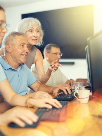 Group of older people studying on computer courseの写真素材